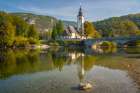 Slovenia, Bled, Lake Bled. Church reflects in lake. Art Print